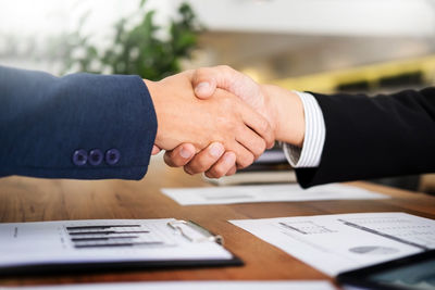 Close-up of hands on table
