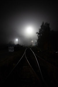 View of railroad tracks at night