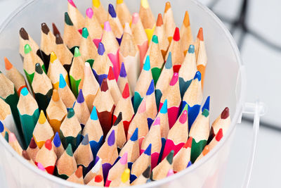 Close-up of multi colored pencils on table