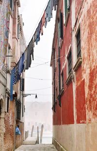 Alley amidst buildings in city