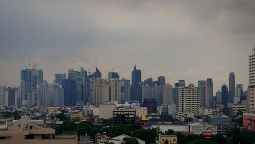 Modern buildings in city against sky