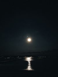 Scenic view of sea against sky at night