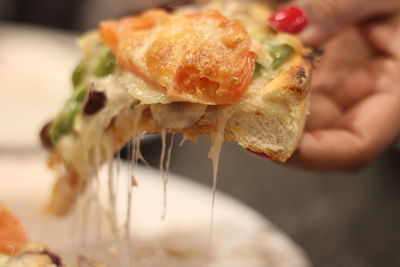 Close-up of hand holding meat