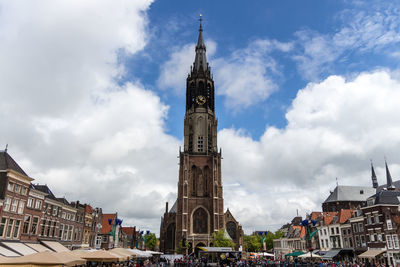 Low angle view of tower against cloudy sky