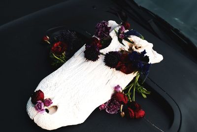 High angle view of red rose on table