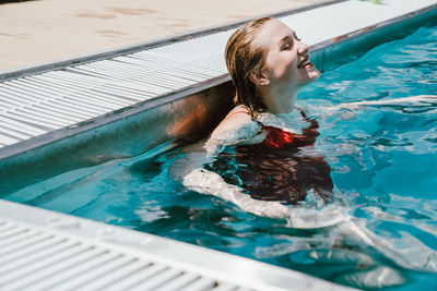 Woman swimming in pool