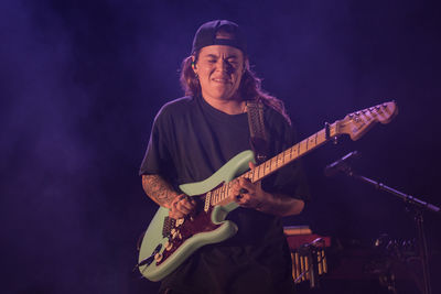 Young man playing guitar