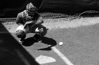 Ball moving towards baseball catcher