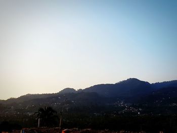 Scenic view of silhouette mountains against clear sky