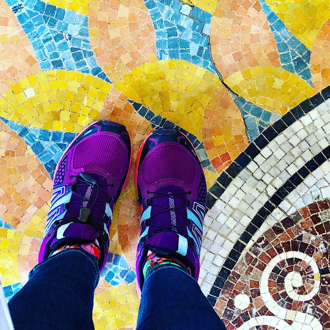 LOW SECTION OF MAN STANDING ON TILED FLOOR