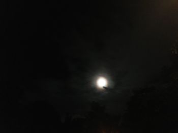 Low angle view of moon in sky at night