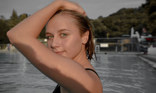 Portrait of young woman in swimming pool