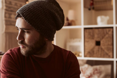 Close-up portrait of young man looking away