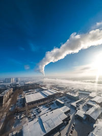 Aerial view of city against sky during winter