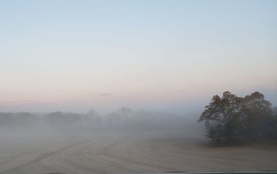 Scenic view of landscape against sky during winter