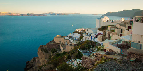 Classical whitewashed buildings by sea