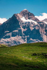 Scenic view of snowcapped mountains against sky