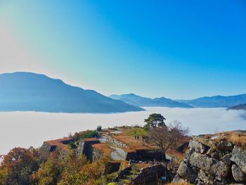 Scenic view of mountains against clear blue sky