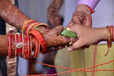 Low section of man holding chain