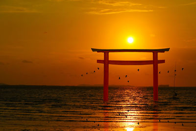 Scenic view of sea against sky during sunset