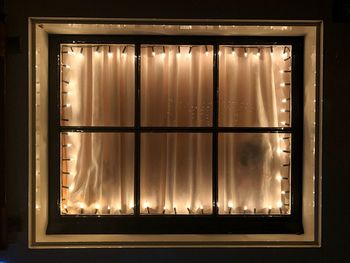 Close-up of illuminated window at night