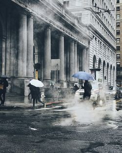 People on street in foggy weather