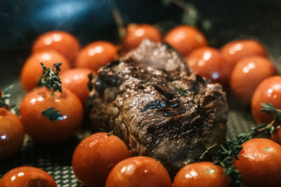 Close-up of meat and tomatoes while cooking