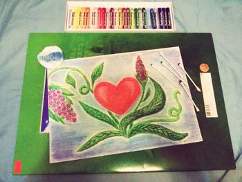 High angle view of multi colored books on shelf