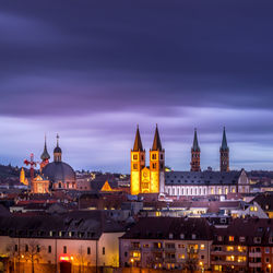 View of buildings in city at dusk