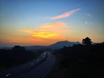 Scenic view of landscape against cloudy sky