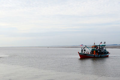 Boat on sea against sky