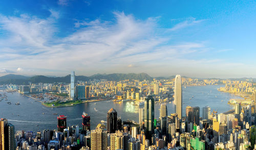 High angle view of cityscape against cloudy sky