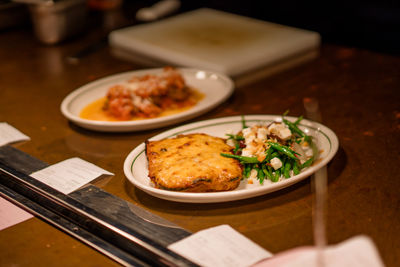 Food on the table waited to be picked up by the waiter