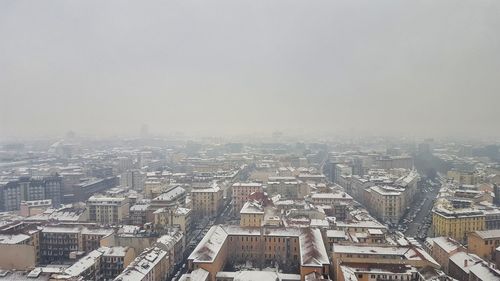 Aerial view of cityscape against sky