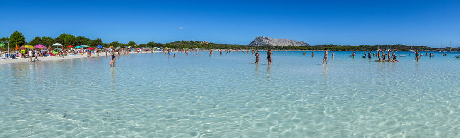 Panoramic view of sea against clear blue sky