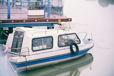 Boats moored at harbor