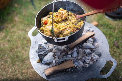 High angle view of meat on barbecue grill