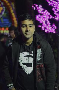 Portrait of young man standing outdoors
