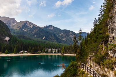 Scenic view of lake by trees against sky