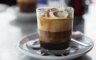 Close-up of coffee served on table