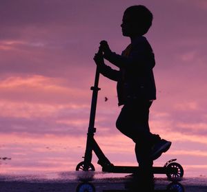 Silhouette of woman at sunset