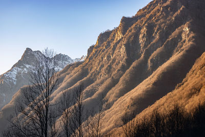 Scenic view of snowcapped mountains against clear sky