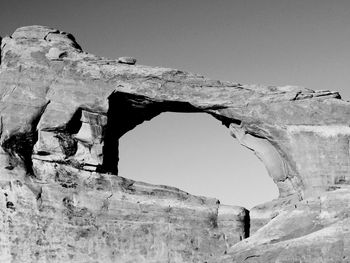 Low angle view of rock formation against sky