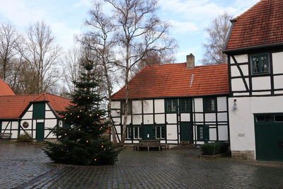 Houses in city against sky