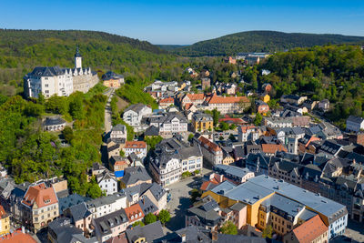 High angle view of townscape and trees in town