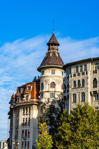 Low angle view of historic building against clear blue sky