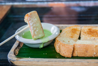 Close-up of bread with dip in tray on table