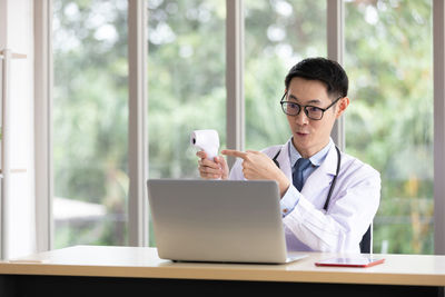Man using laptop on table