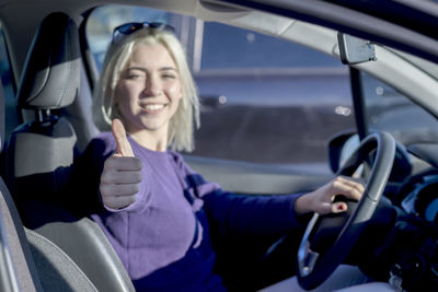 Portrait of woman driving car