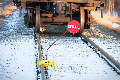 Closeup of a derail sign on a track rail.